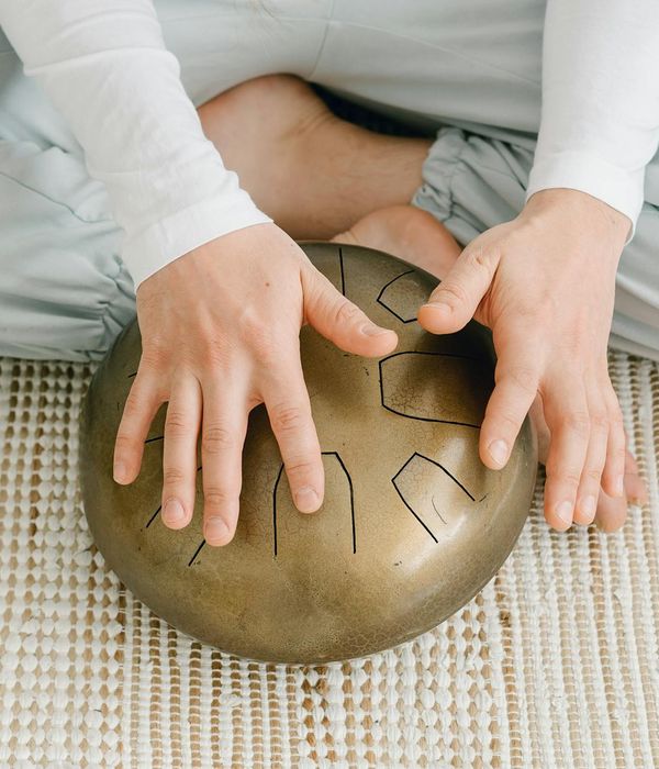Serene woman meditating, symbolizing the energy and peace from regular practice.